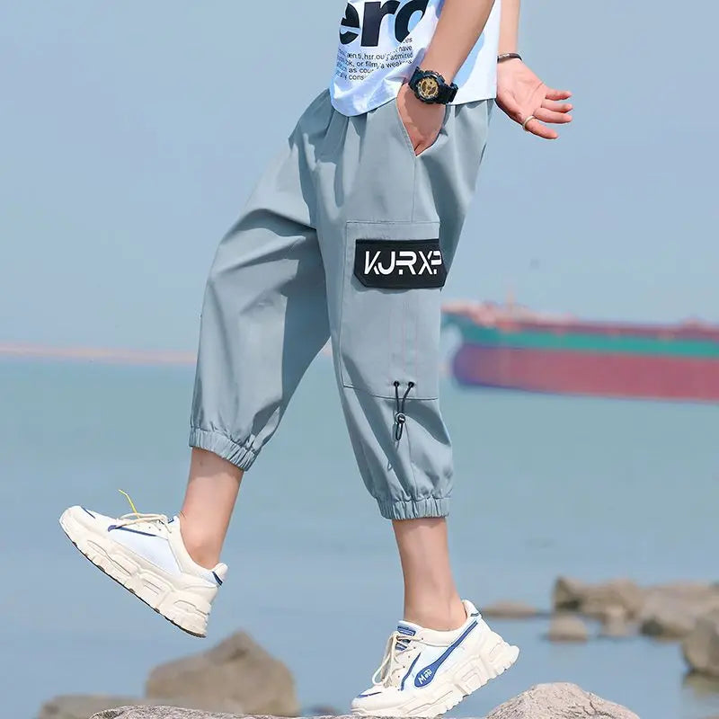Neueste Cropped Pants Herren Overalls Sommer Dünn Lässig Trend Jugend Student Cargohose Lockere konisch zulaufende Reithose