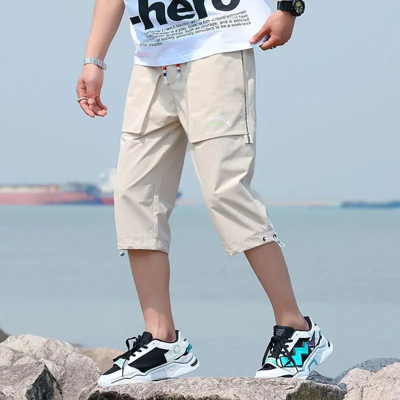 Neueste Cropped Pants Herren Overalls Sommer Dünn Lässig Trend Jugend Student Cargohose Lockere konisch zulaufende Reithose