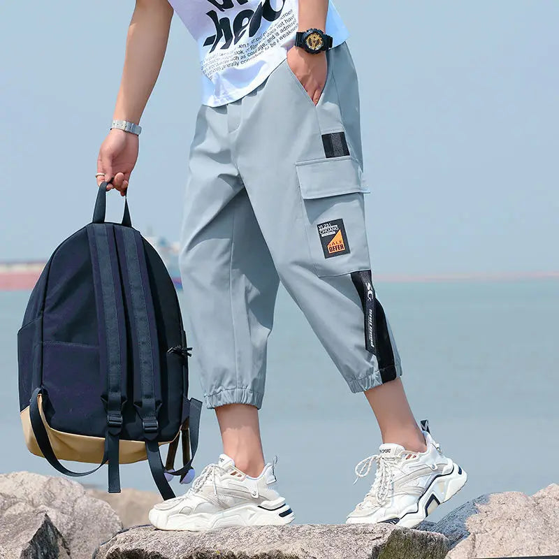 Neueste Cropped Pants Herren Overalls Sommer Dünn Lässig Trend Jugend Student Cargohose Lockere konisch zulaufende Reithose