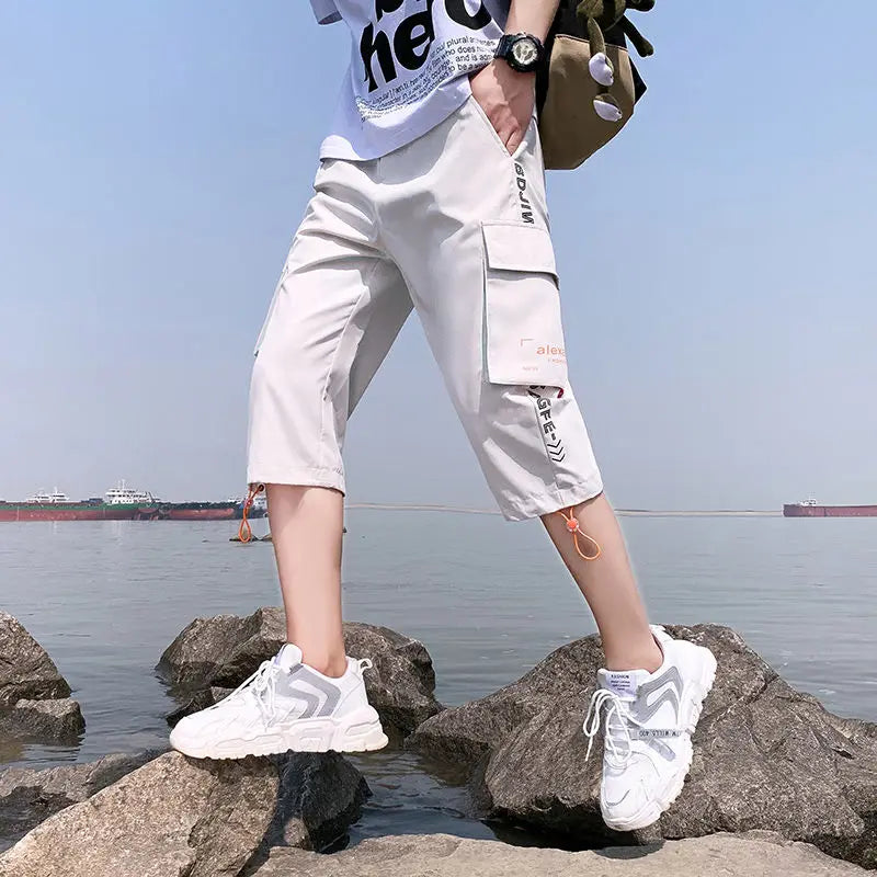 Neueste Cropped Pants Herren Overalls Sommer Dünn Lässig Trend Jugend Student Cargohose Lockere konisch zulaufende Reithose