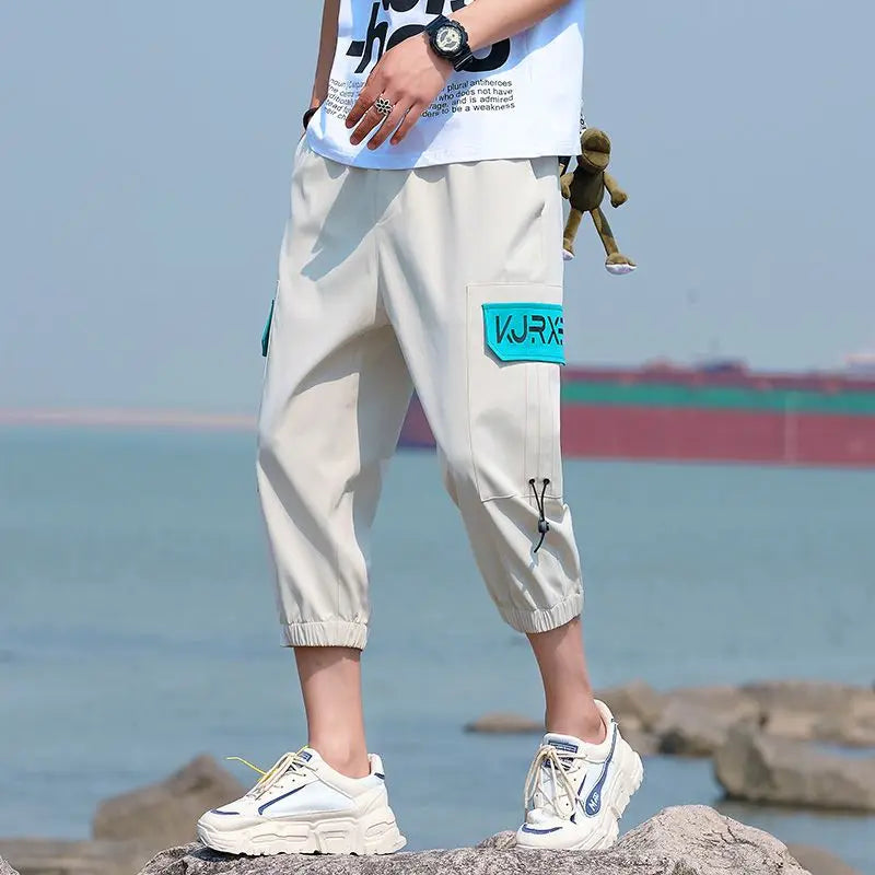 Neueste Cropped Pants Herren Overalls Sommer Dünn Lässig Trend Jugend Student Cargohose Lockere konisch zulaufende Reithose 