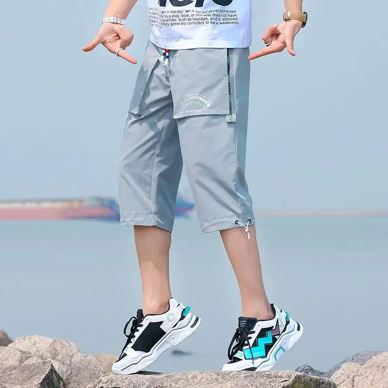 Neueste Cropped Pants Herren Overalls Sommer Dünn Lässig Trend Jugend Student Cargohose Lockere konisch zulaufende Reithose 